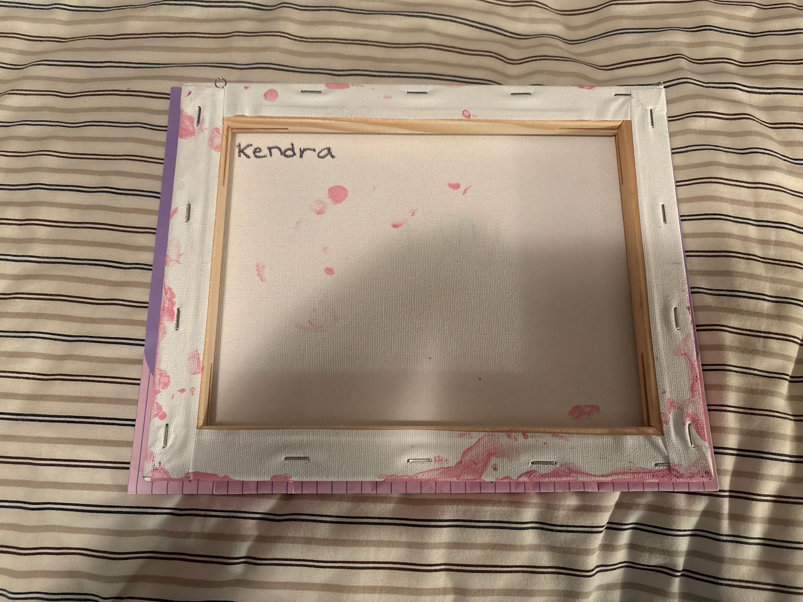 Back of the canvas, signed Kendra